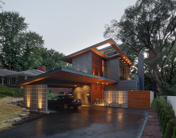 a contemporary carport that has breeze block wall instead of posts as the support