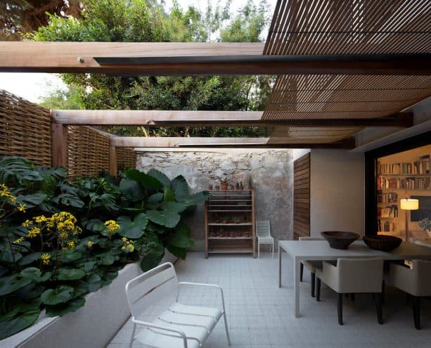 a trendy covered walkout basement patio of a small house