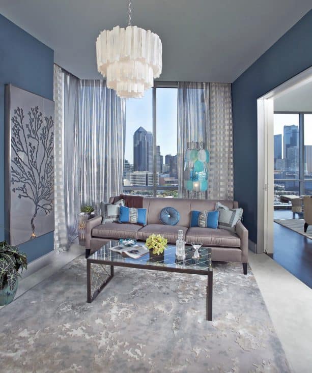 semi-sheer silver curtains in a blue and grey interior
