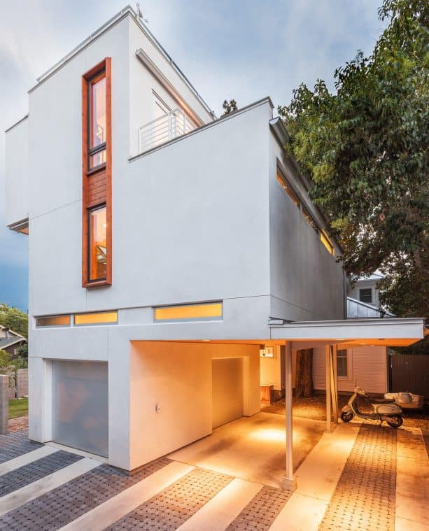 a more spacious contemporary, attached carport with roof extension