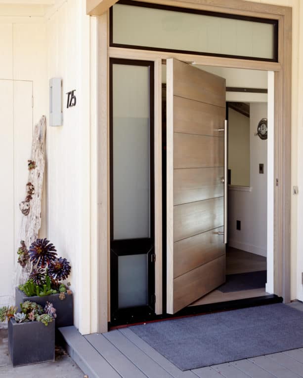 contemporary white oak Solace front door with custom frame and threshold by Pivot Door Company
