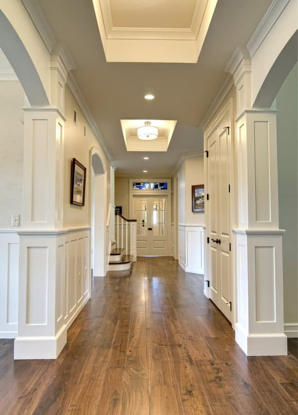 a hallway with warm white paint