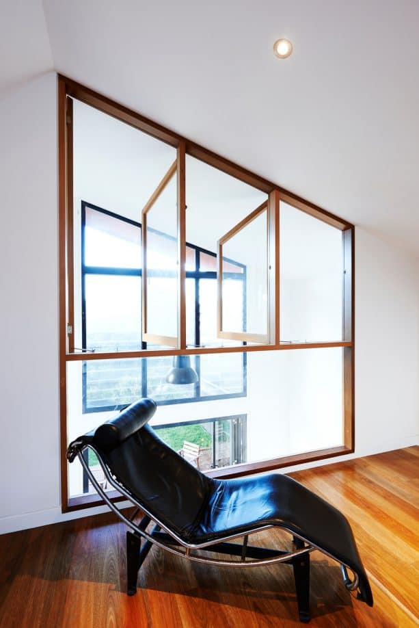 an interior window in a contemporary room with equal height and position with the exterior window in the next room