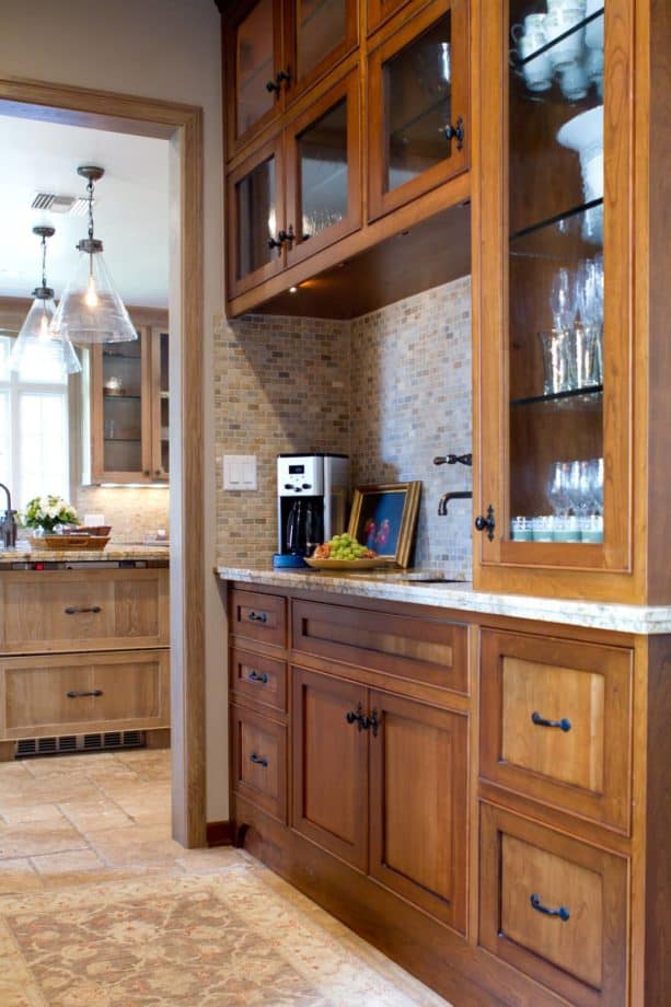 cherry stained natural floor to ceiling cabinets with a clear coat