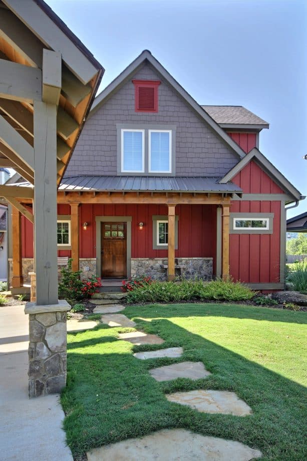 farmhouse exterior with brown-stained door and grey trim