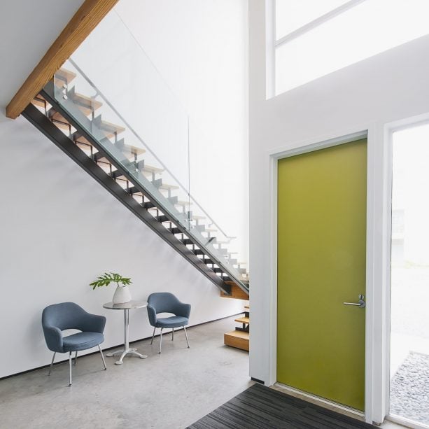 modern entry with olive green door and white trim paint color