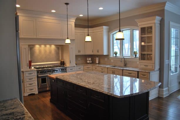traditional kitchen with antique white cabinets and benjamin moore revere pewter gray wall color