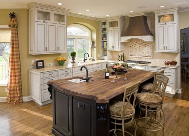 traditional kitchen with antique white cabinets with chocolate glaze