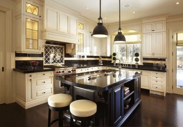 cream cabinets with polished brown granite tops