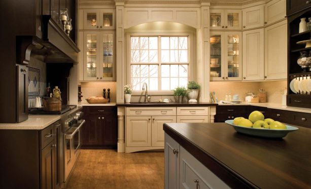 cream kitchen cabinets with dark wood countertops