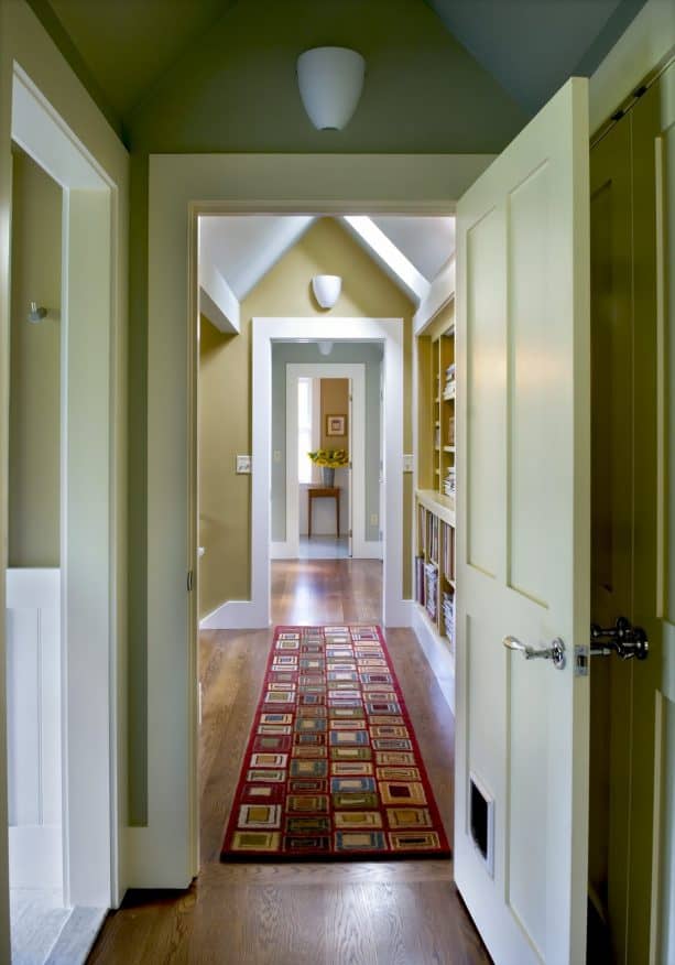 hallway with golden color and white trim