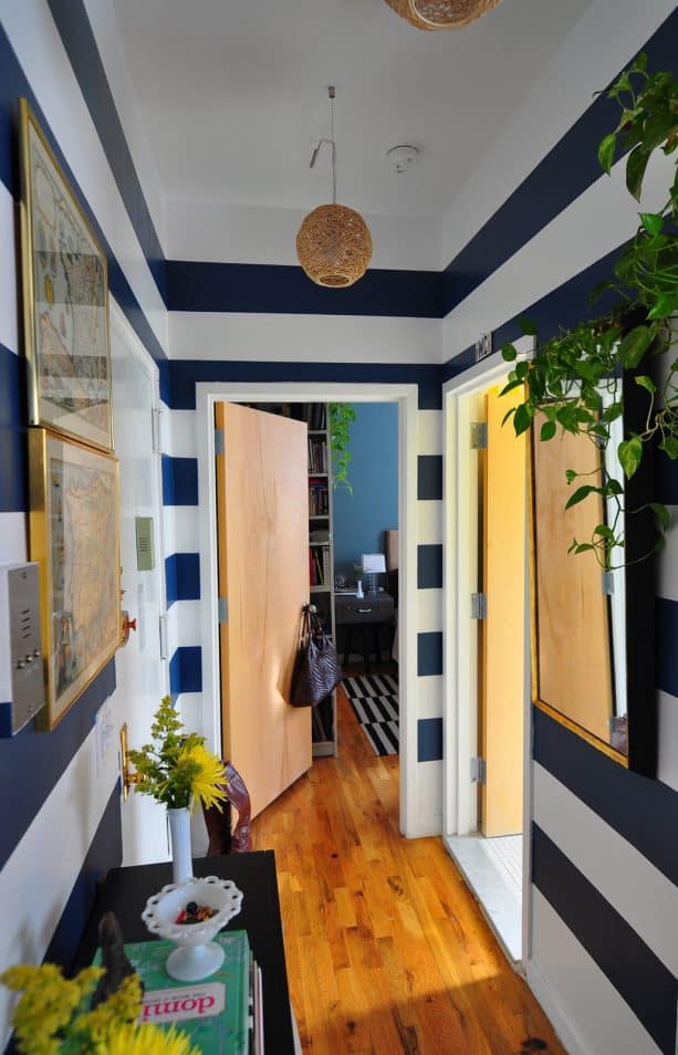 hallway with navy blue and white horizontal stripes wall
