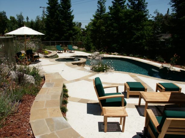 small custom inground pool with dark bottom