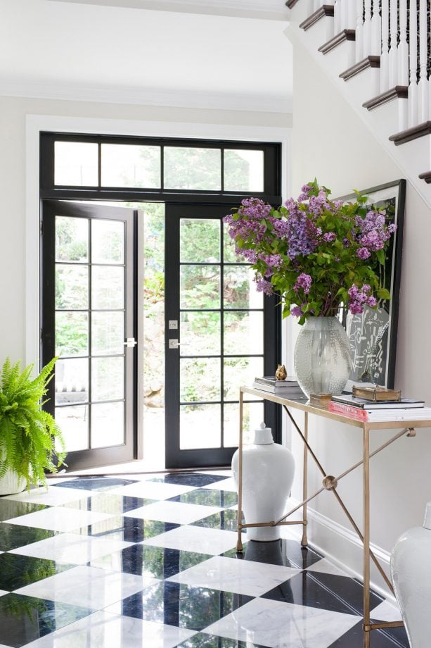 black and white marble floor in a transitional entry