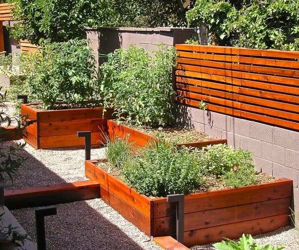 fencing from cinder block and wood with compatible planters