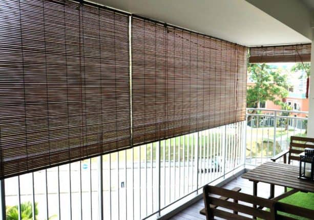 the use of roll-up bamboo blinds in a balcony