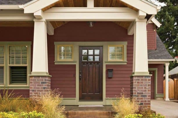 front door with brown stain and oyster tan-painted trim