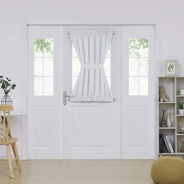 a white French door panel curtain with tieback for adding privacy in a half glass door design