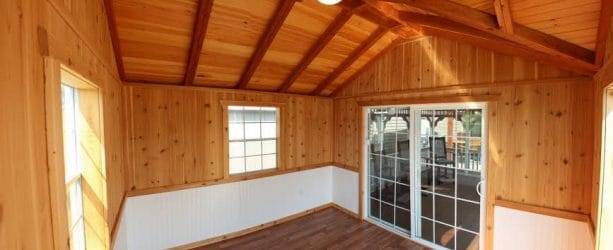 a pool house with cedar tongue and groove roof deck