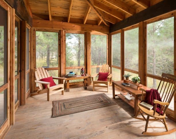 a rustic screened porch with tongue and groove deck for the roof