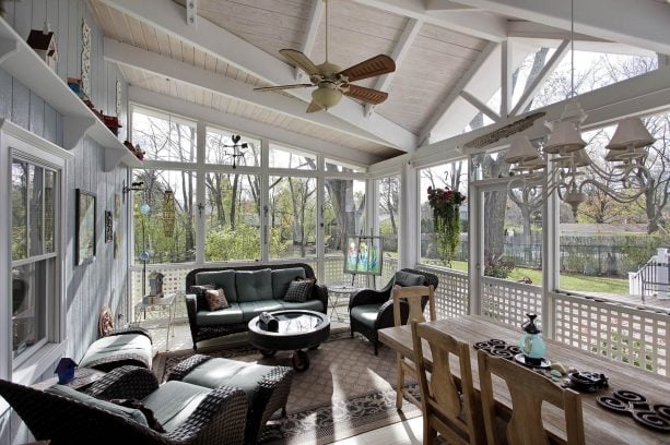 a traditional sunroom with whitewashed tongue and groove roof deck