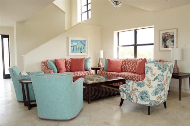 turquoise and coral furniture in a beach-style living room