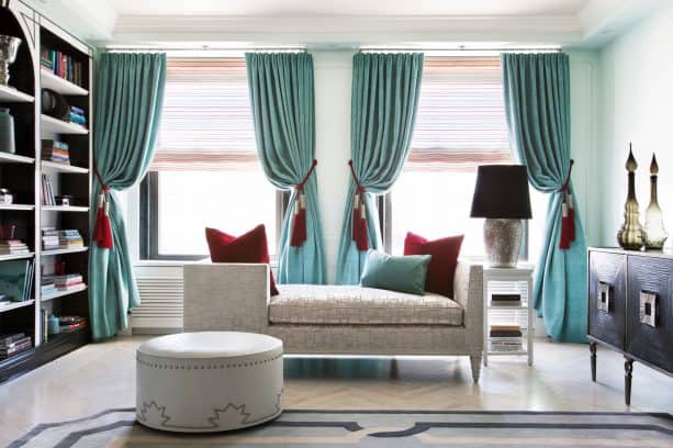 turquoise drapes with red tasseled-tiebacks