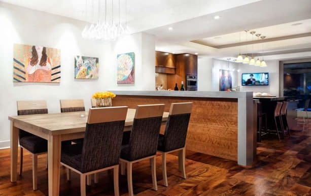 wood and concrete half wall to separate kitchen and dining area
