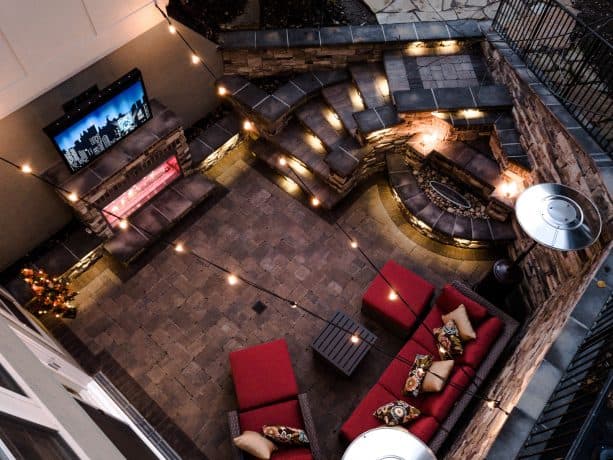 a modern walkout basement patio with complete features and gorgeous lighting