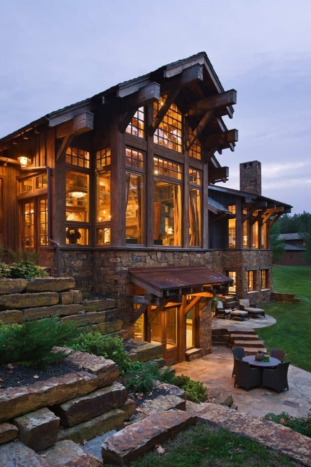 a traditional walkout basement patio with a dining table set and cozy atmosphere