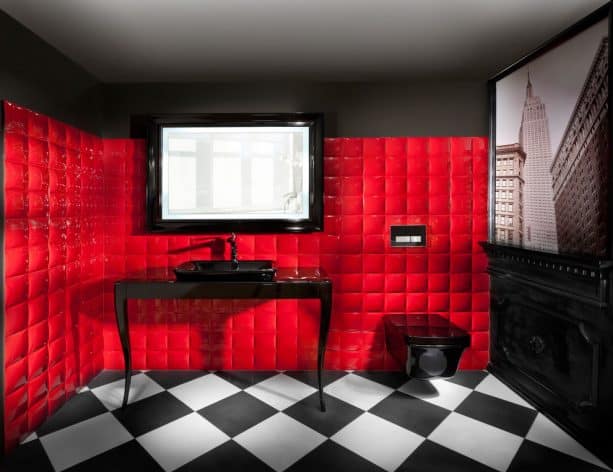 elegant red and black bathroom with unique red cushioned-like tiled wall