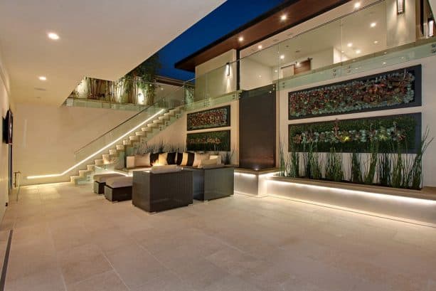 the seating area, water feature, and vertical garden in the walkout basement patio