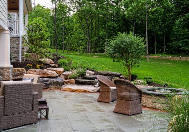 the stunning landscape design and views from the walkout basement patio