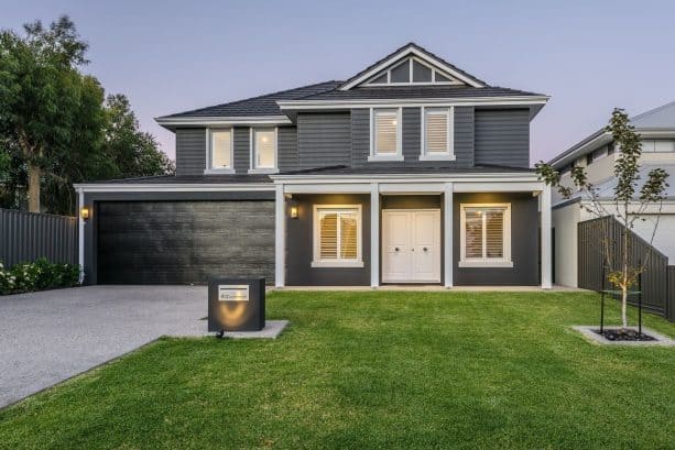 a dark grey house with charcoal roof