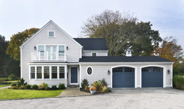 a traditional exterior with Benjamin Moore Newburyport Blue front and garage doors