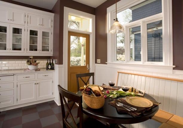 a wood door with wood door as a match of a burgundy wall tone