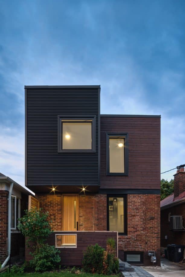 a contemporary exterior with half mixed-red brick and half metal siding combination