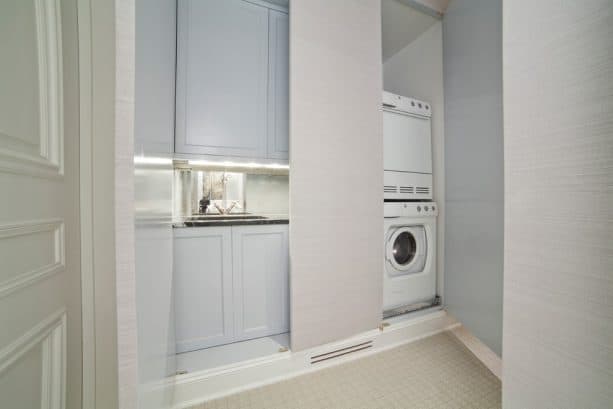 a hidden laundry closet behind the flat doors