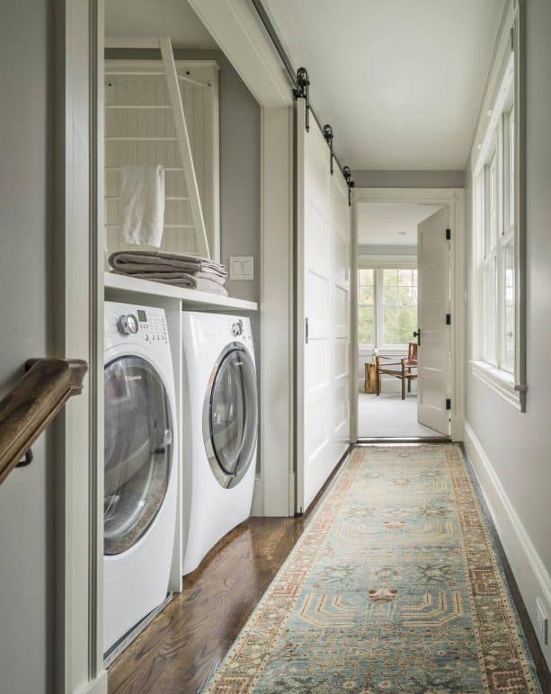 a large sliding door for a laundry closet built in a narrow place