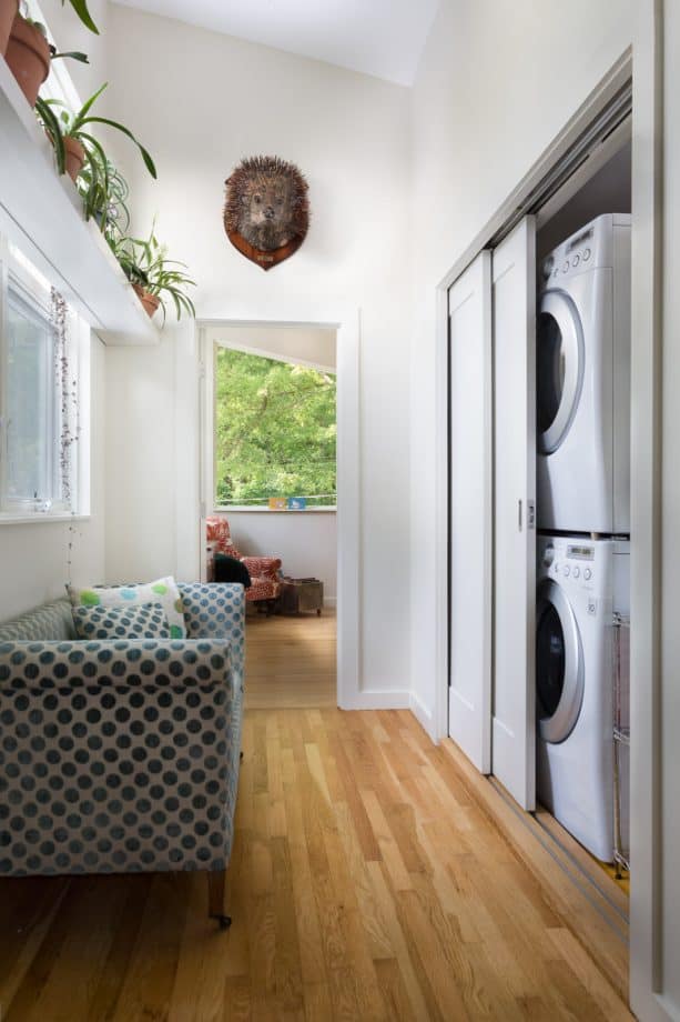a laundry closet with pocket doors