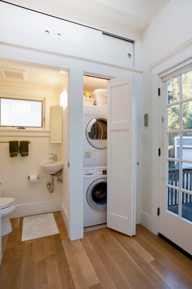 a mini laundry closet with folded door