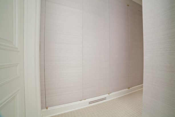 flat-panel laundry closet doors that look like a wall