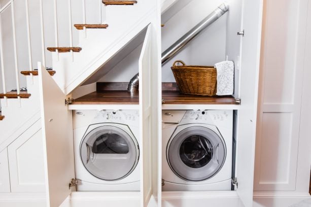 under-stair laundry closet with custom doors