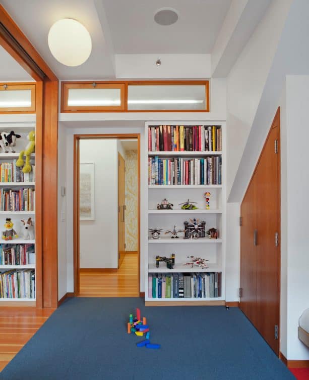 a kids room with transom windows in the wall design