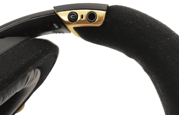 Image shows the power button and the AUX input jack port.