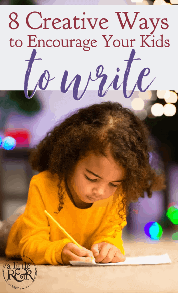 child laying on floor writing