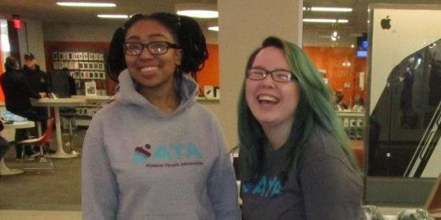 two teen girls laughing