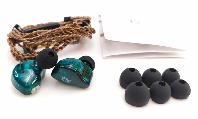 Images shows the contents which include the earphones, cable, ear tips and user guide laid out for photographic purposes.
