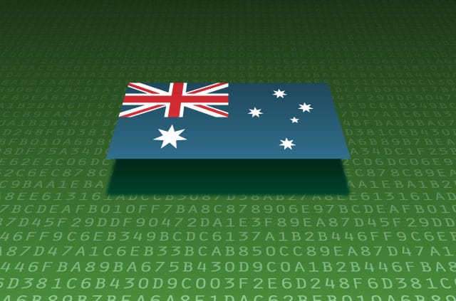 australia-cyber-security-bill An Australian flag sits atop a series of alphanumeric digits.