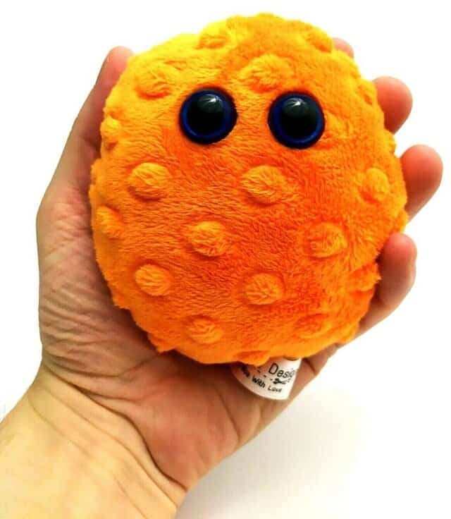 Image shows my worry pet in my left hand. My hand is clenched around the worry pet.